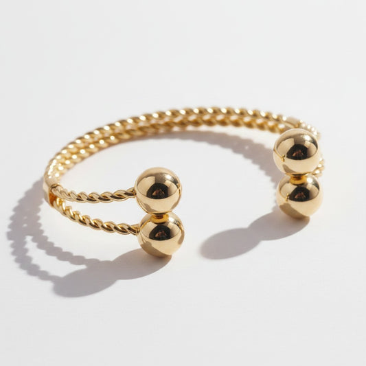 Brazalete Torque Trenzado con Esferas – Baño de Oro