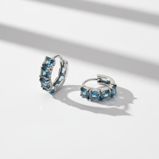 Argollas Circonitas Celestes 12mm – Baño de Rodio