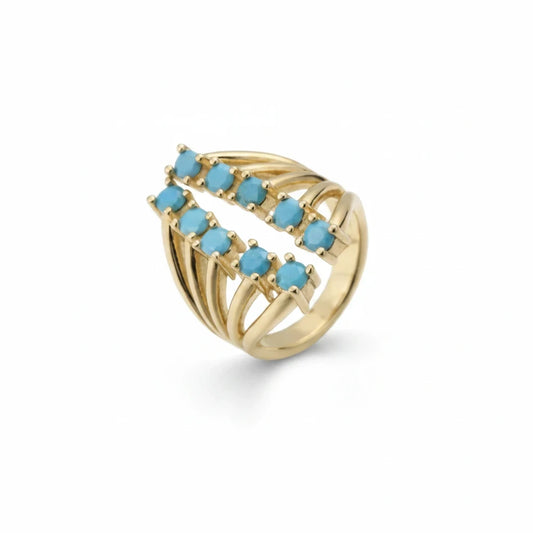Anillo abierto Ámbar Joyas multibanda en tono dorado con circonitas azules redondas en diseño cruzado.