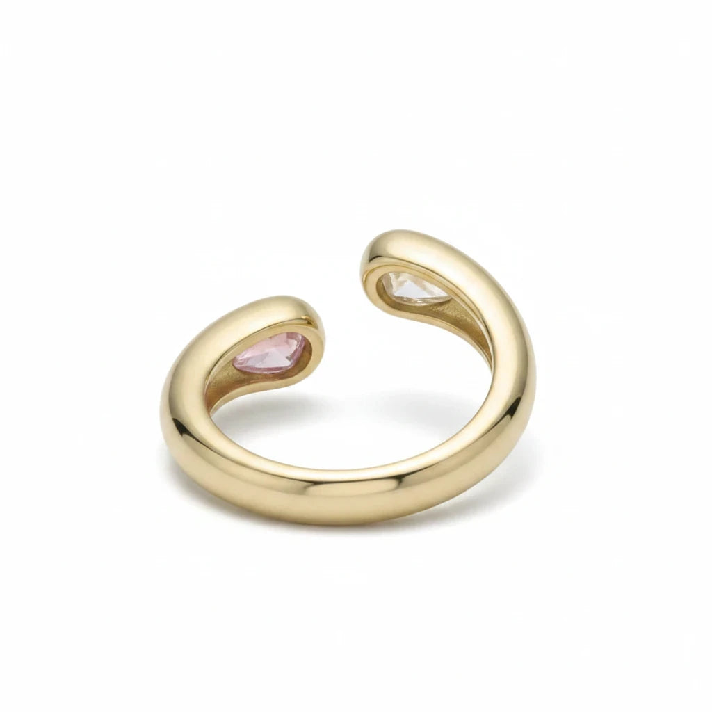 Anillo abierto Ámbar Joyas en tono dorado con dos gotas de circonita, una rosa y otra transparente