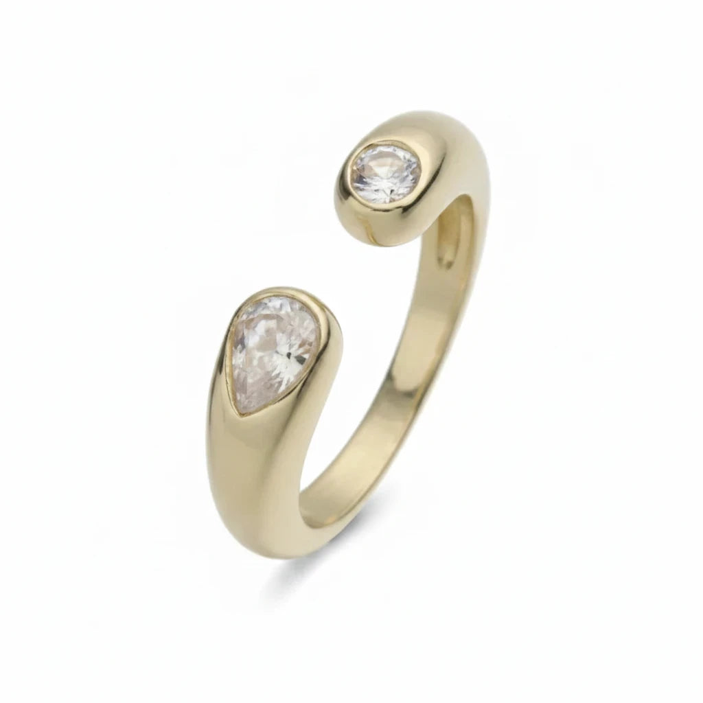 Anillo abierto Ámbar Joyas en tono dorado con dos circonitas blancas en forma de gota y banda pulida ajustable