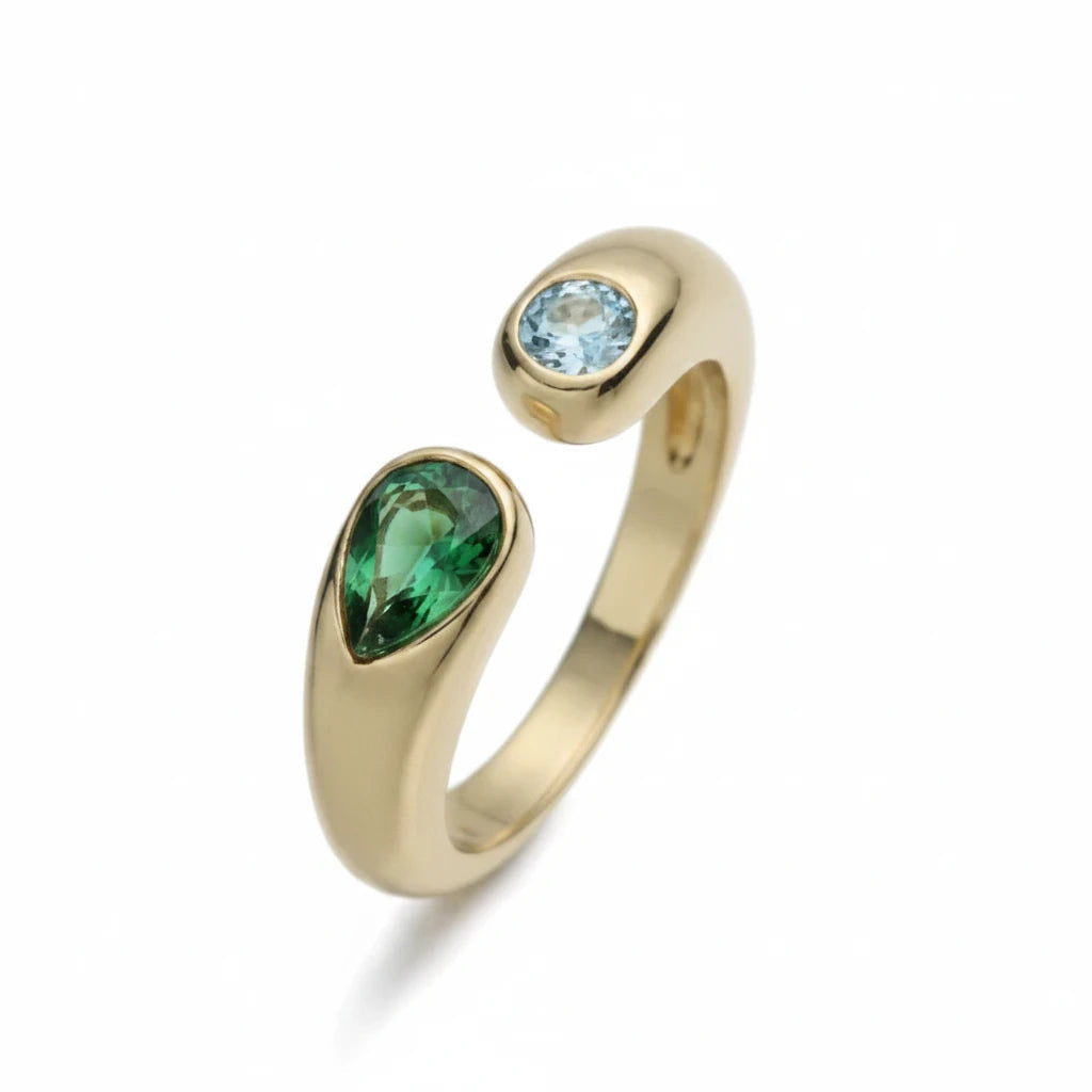 Anillo abierto Ámbar Joyas en tono dorado con circonitas verde esmeralda en forma de lágrima y azul celeste redonda